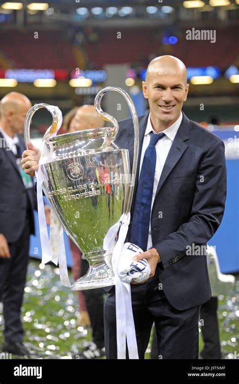 Real Madrid Coach Zinedine Zidane poses with the Champions League Trophy after the UEFA ...