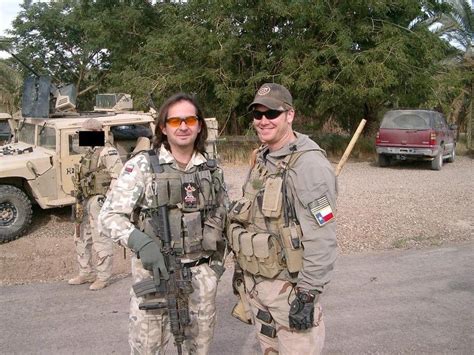 A soldier of the Polish Army's JW GROM stands with famous U.S. NAVY ...