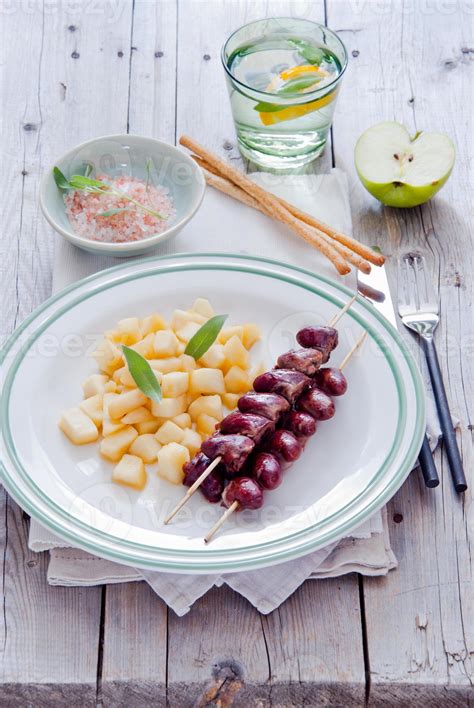 Grilled chicken hearts on skewers with stewed apples 719657 Stock Photo ...