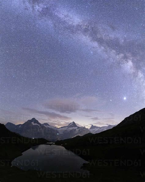 Milky Way over Bachalpsee lake on a summer night, Grindelwald, Jungfrau Region, Bernese Oberland ...