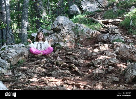 little girl meditating in the forest Stock Photo - Alamy