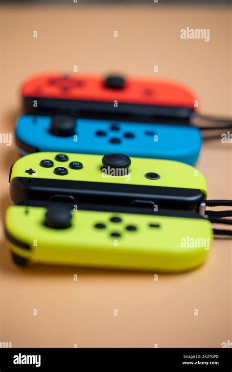 Nintendo Switch Joy-Cons aligned in a row. Yellow blue and red Joy-Cons ...