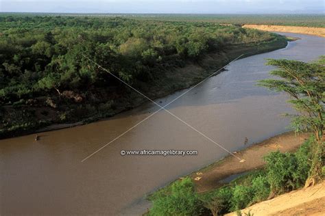 Photos and pictures of: view of the Omo river with boats crossing, Omo ...