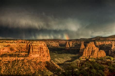 A rainbow ???? follows a fleeting storm at Colorado National Monument ...