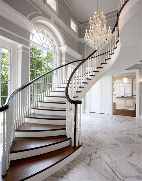 Grande sweeping entry staircase in grey neutral foyer Hallway Foyer ...