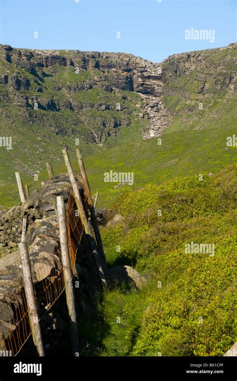 A dry Kinder Downfall waterfall from below the Kinder Scout plateau ...