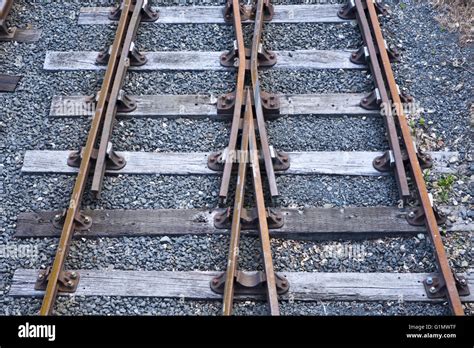 Railway lines crossing diamond junction diamond crossed Stock Photo - Alamy