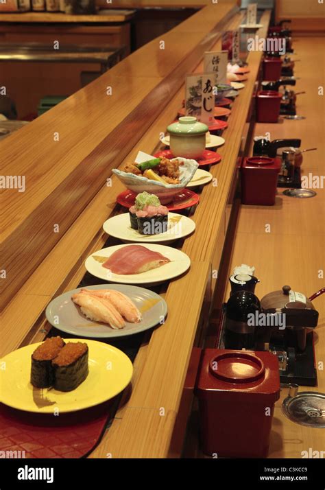 Conveyor belt sushi Stock Photo - Alamy