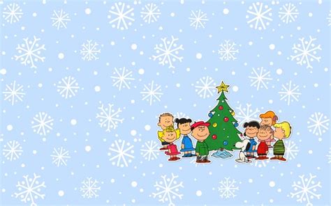 a group of cartoon characters around a christmas tree with snowflakes in the background