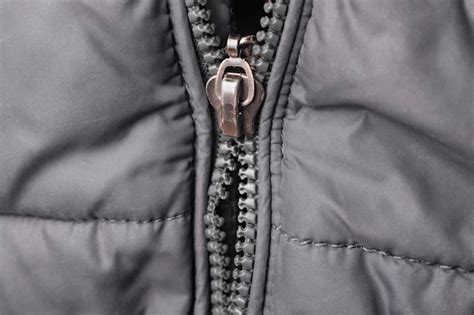 Premium Photo | Closeup of a broken zipper on a jacket