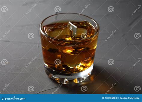 Glass rum glass with ice stock image. Image of whiskey - 181485483