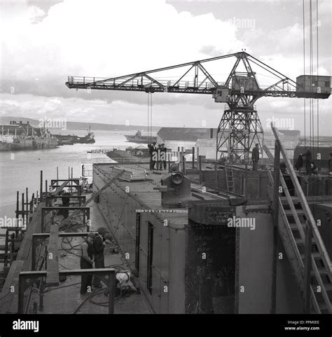 1950s, historical, a ship being built at the Harland and Wolff shipyard at Belfast docks ...