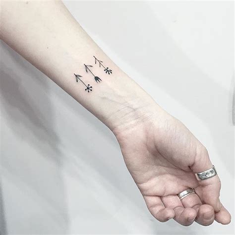 Tiny flower tattoos on the wrist - Tattoogrid.net