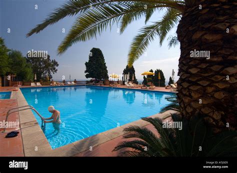 The swimming pool of a resort hotel in Taormina Sicily Italy Stock ...