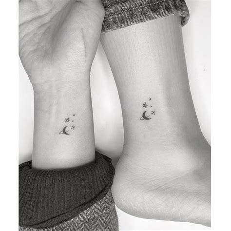 Minimalist matching airplane, moon and star tattoo for