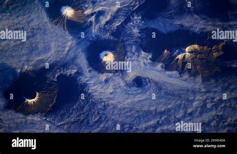 Alaska Aleutian island volcanoes sunrise aerial satellite view Stock ...