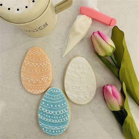 Piping Icing Easter Egg Biscuits - Enchanting Bakes