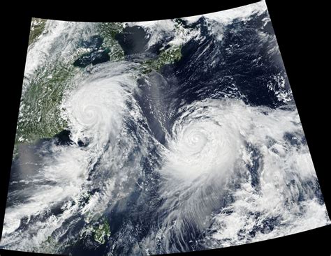 "Twin typhoons continued to churn across the Western Pacific Ocean ...