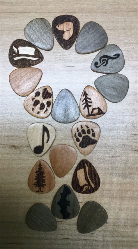 Custom made wooden guitar picks, some with burnt image on them | Guitar picks diy, Guitar art ...