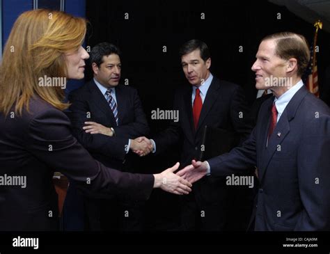 New Jersey Attorney General Anne Milgram (L) shakes hands with ...