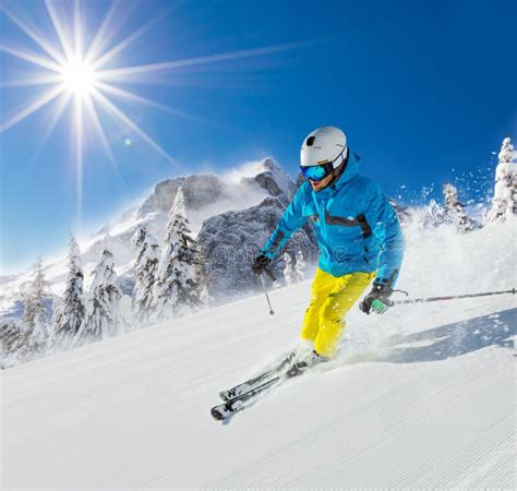 Young Man Skiing Downhill in Alps Stock Photo - Image of freerider, adult: 108717574