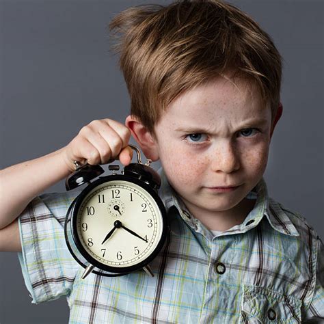 10+ Impatient Boy Looking At Watch Stock Photos, Pictures & Royalty-Free Images - iStock