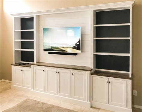 White Entertainment Center with Shiplap Upper and Painted Shelf Backing | Living room ...