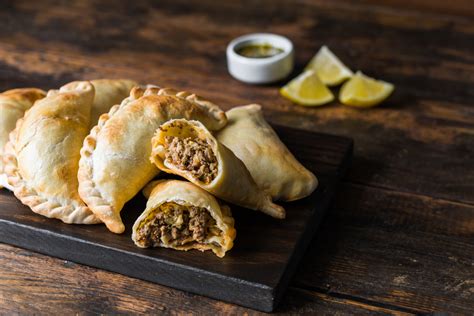 Traditional baked Argentine empanadas savoury pastries with meat beef ...