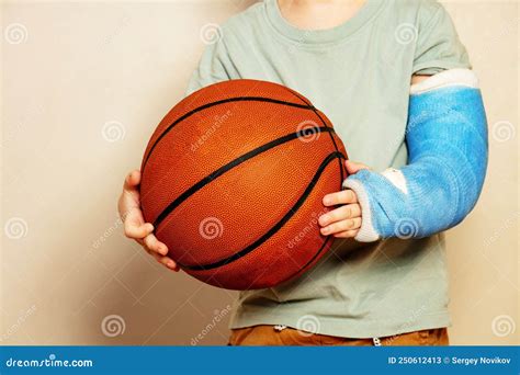 Big Basketball Ball in Hands of Boy with Broken Hand Cast Stock Image - Image of kids, accident ...