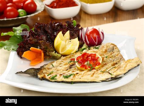 Grilled fish with vegetables Stock Photo - Alamy