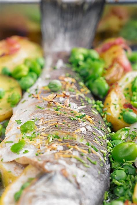 Whole Baked Sea Bass with Potatoes, Broad Beans and Peas | Krumpli