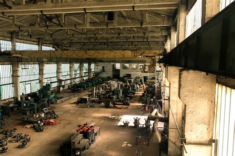 Free Photo | Old factory hall with equipment and machines and workers