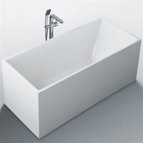 a white bath tub sitting next to a faucet