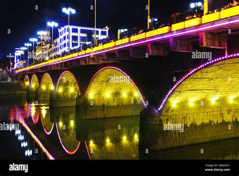 Stone arch bridge in the night Stock Photo - Alamy