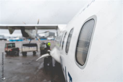 airplane window from the outside at the airport Stock Photo | Adobe Stock