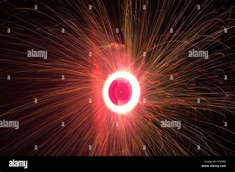 Catherine wheel firework spinning Stock Photo - Alamy