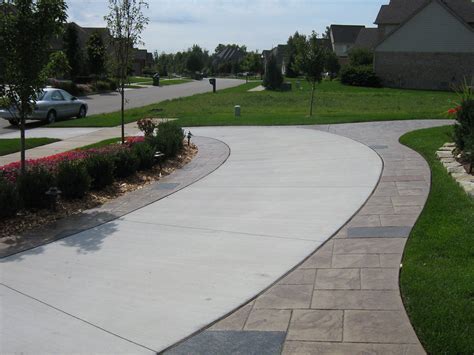 cg: Front. Blocks edging our solid driveway. Curving around side to ...