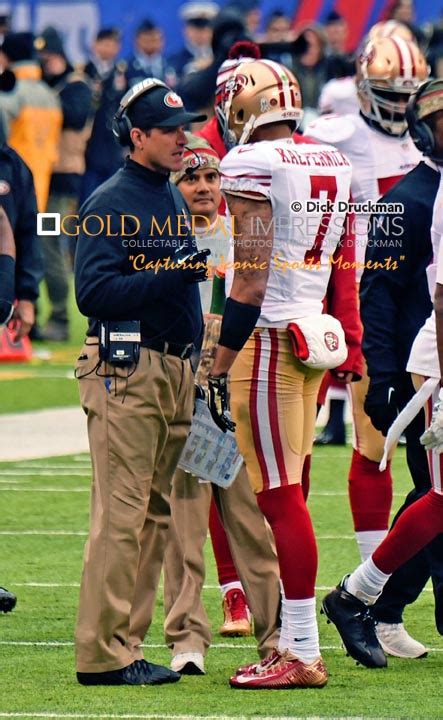 JIM HARBAUGH 49ERS head coach talks with quarterback COLIN KAEPERNICK ...