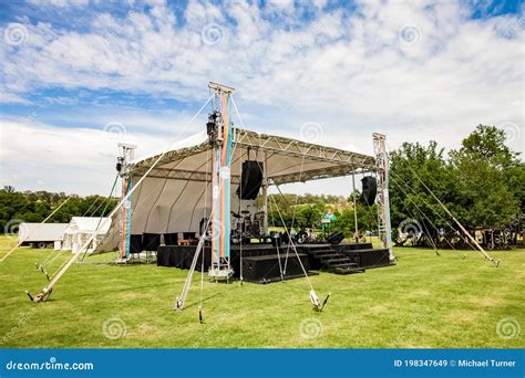 Small Outdoor Concert Venue Stage and Lighting in a Empty Field ...