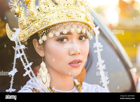 Beautiful portrait young asian woman wearing traditional Indonesian Lampung culture clothes ...