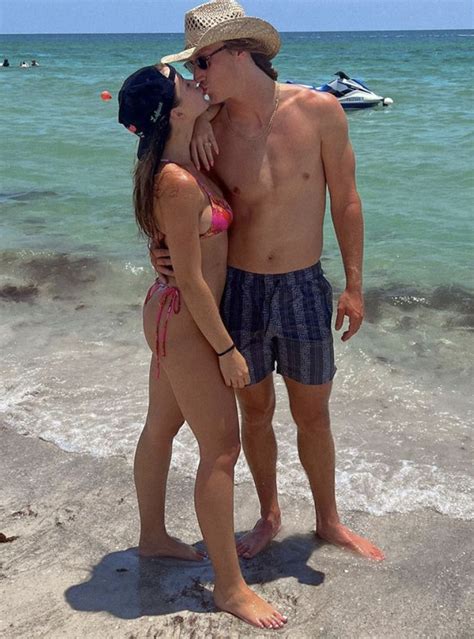 Trevor Lawrence kisses wife Marissa on the beach during trip