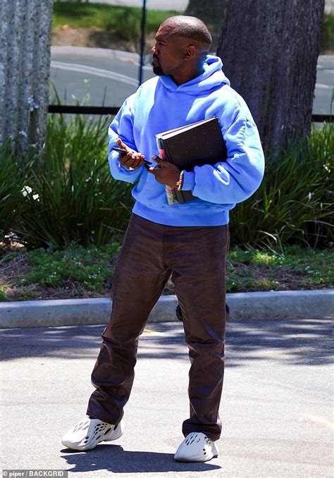 Kanye West dons new Yeezy Foam Runners and a bright blue hoodie after ...