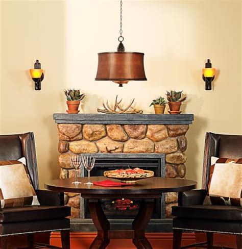 A rustic dining room fireplace flanked by Kichler wall sconces. - Lighting & Decor by LampsPlus.com
