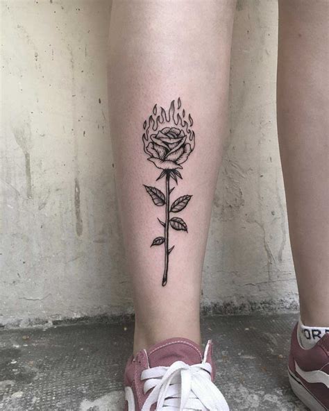 Burning rose tattoo on the shin - Tattoogrid.net