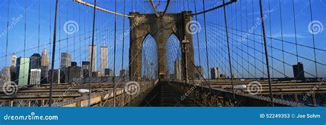 This is a Close-up of the Brooklyn Bridge Walkway To Manhattan. the Manhattan Skyline is in the ...