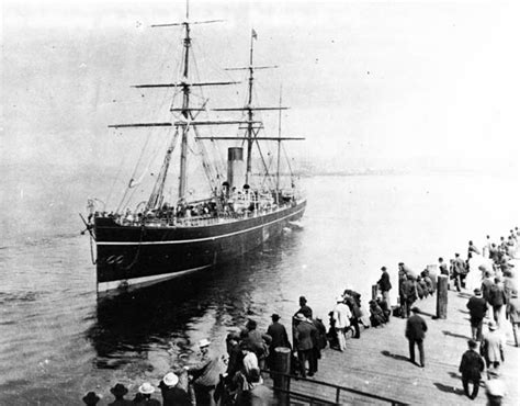 Parthia unloading cargo summer of 1887. Note her funnel almost hidden in the rigging.