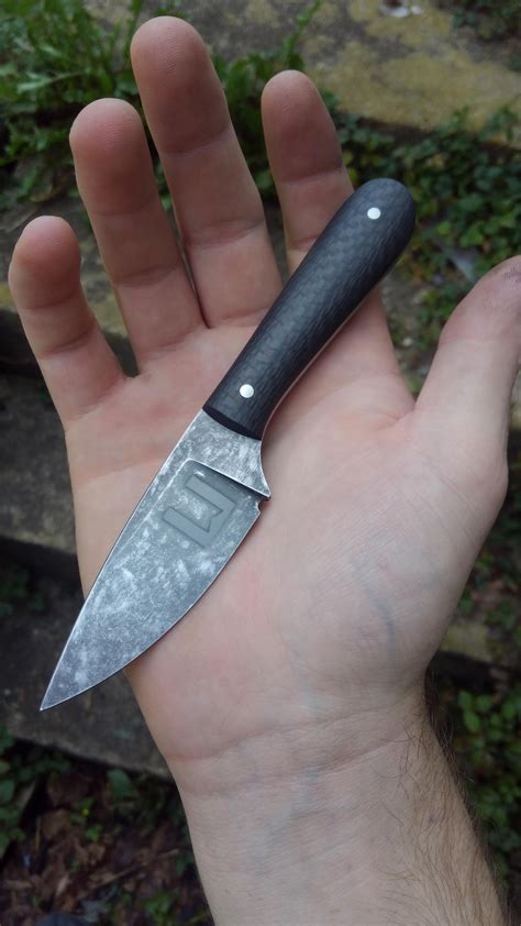 Small EDC fixed-blade I finished this weekend. Etched-and-tumbled blade with carbon fiber scales ...