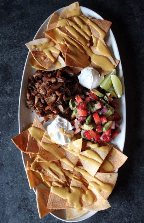 Loaded Nachos w/ Avocado Strawberry Pico, Roasted Jalapeno Queso, Meaty Oyster Mushrooms, and ...