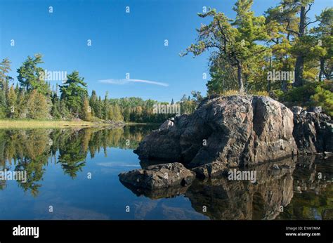 Lake, boreal forest and island of Canadian Shield rock in Quetico Provincial Park, Ontario ...