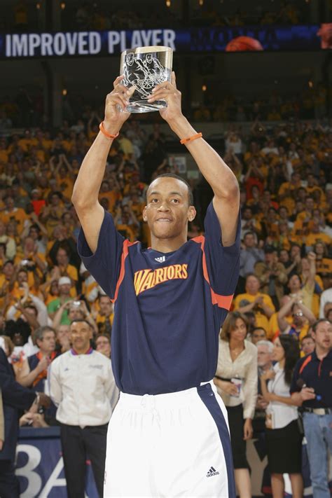 Monta Ellis holds up his "Most Improved Player" award before Game 3 ...